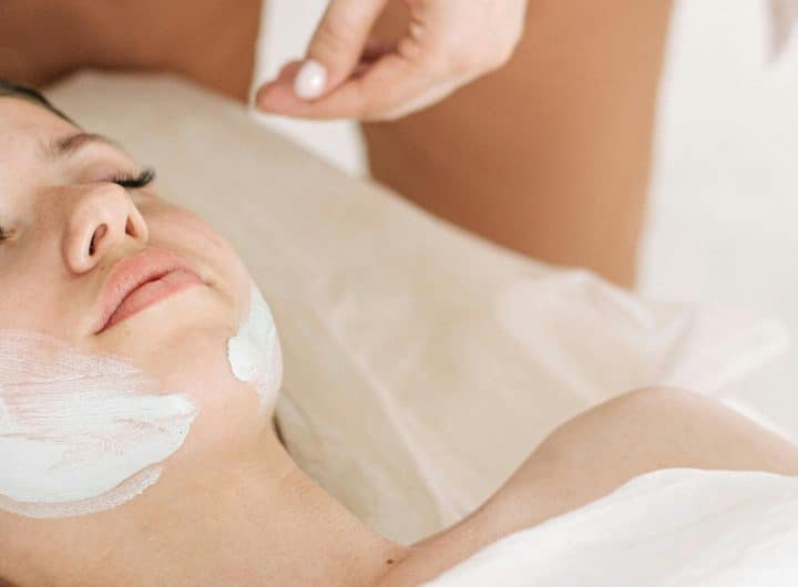 High-Tech Skincare Tools in action: Technology in skincare regimen with a relaxing facial treatment using a cosmetic brush to apply a white mask on a woman's face at the EMS Beauty Device Blog.