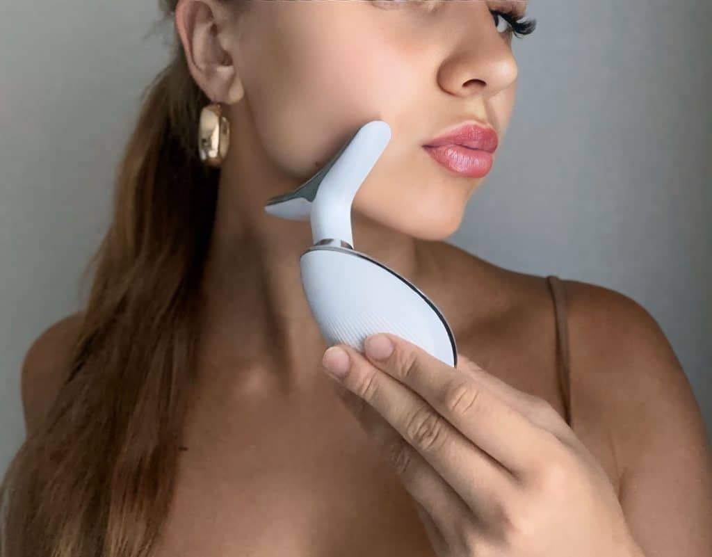 Using EMS face lifting device for collagen boost and facial massage