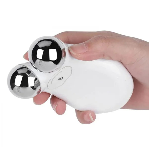 Hand holding the facial toning device to show portability and compact size