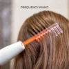 High frequency wand with comb probe in use on scalp for hair stimulation